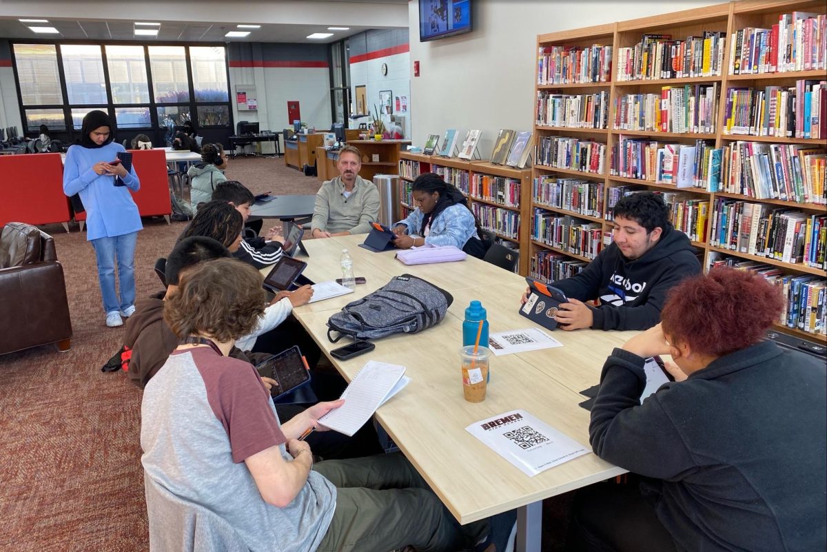 Mr. Cappel tutors students on Nov. 19 after school in the IMC. Bremen provides free tutoring on Tuesdays and Thursdays from 3-4pm for all students looking for academic assistance. 